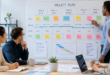 Project manager reviewing a project timeline and planning board